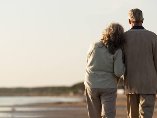 The Frankfurt city surrounded by buildings under a cloudy sky during a golden sunset in Germany