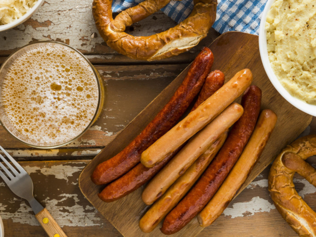 The Frankfurt city surrounded by buildings under a cloudy sky during a golden sunset in Germany